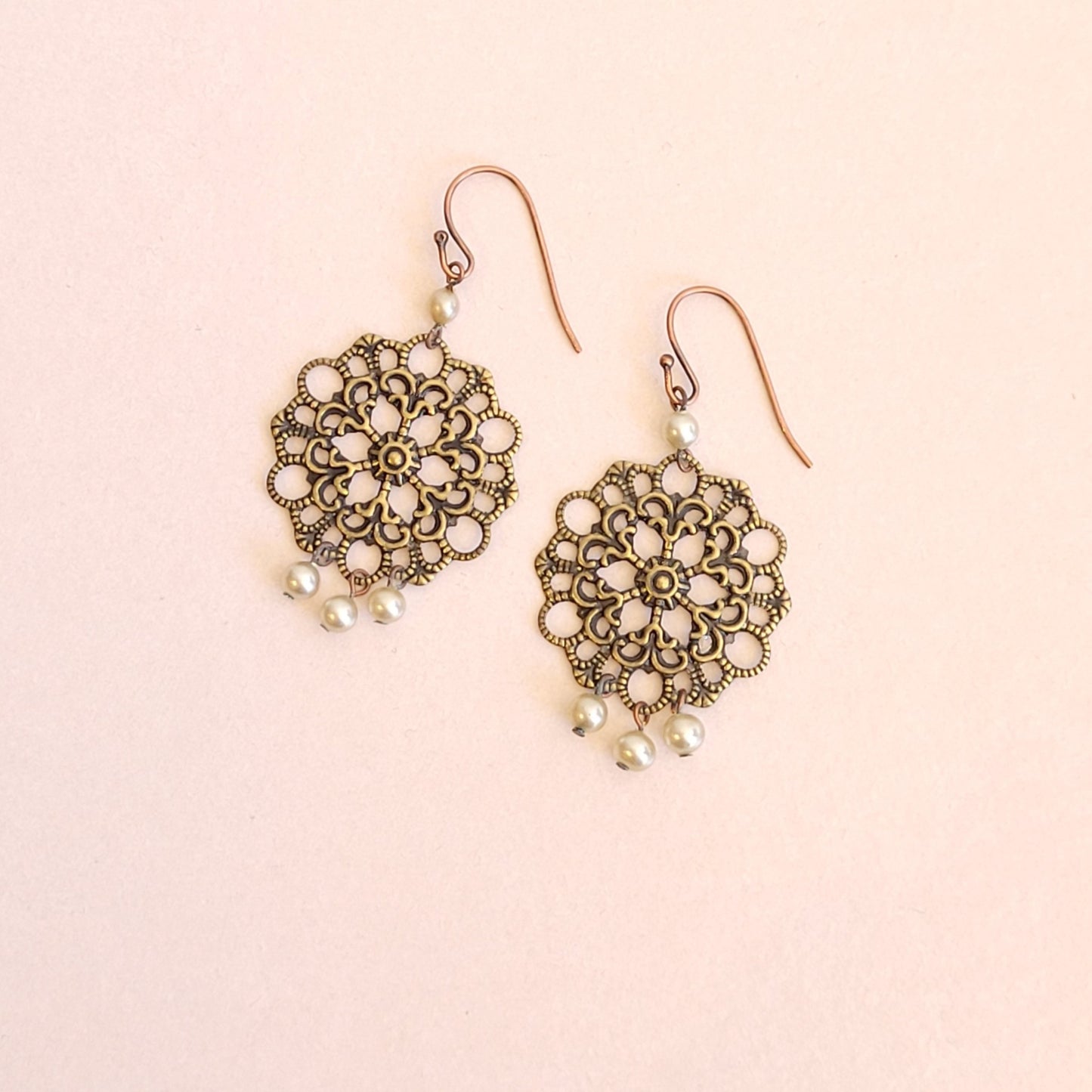 Eileen; bronze lacy filigree shield, faux pearl dangles