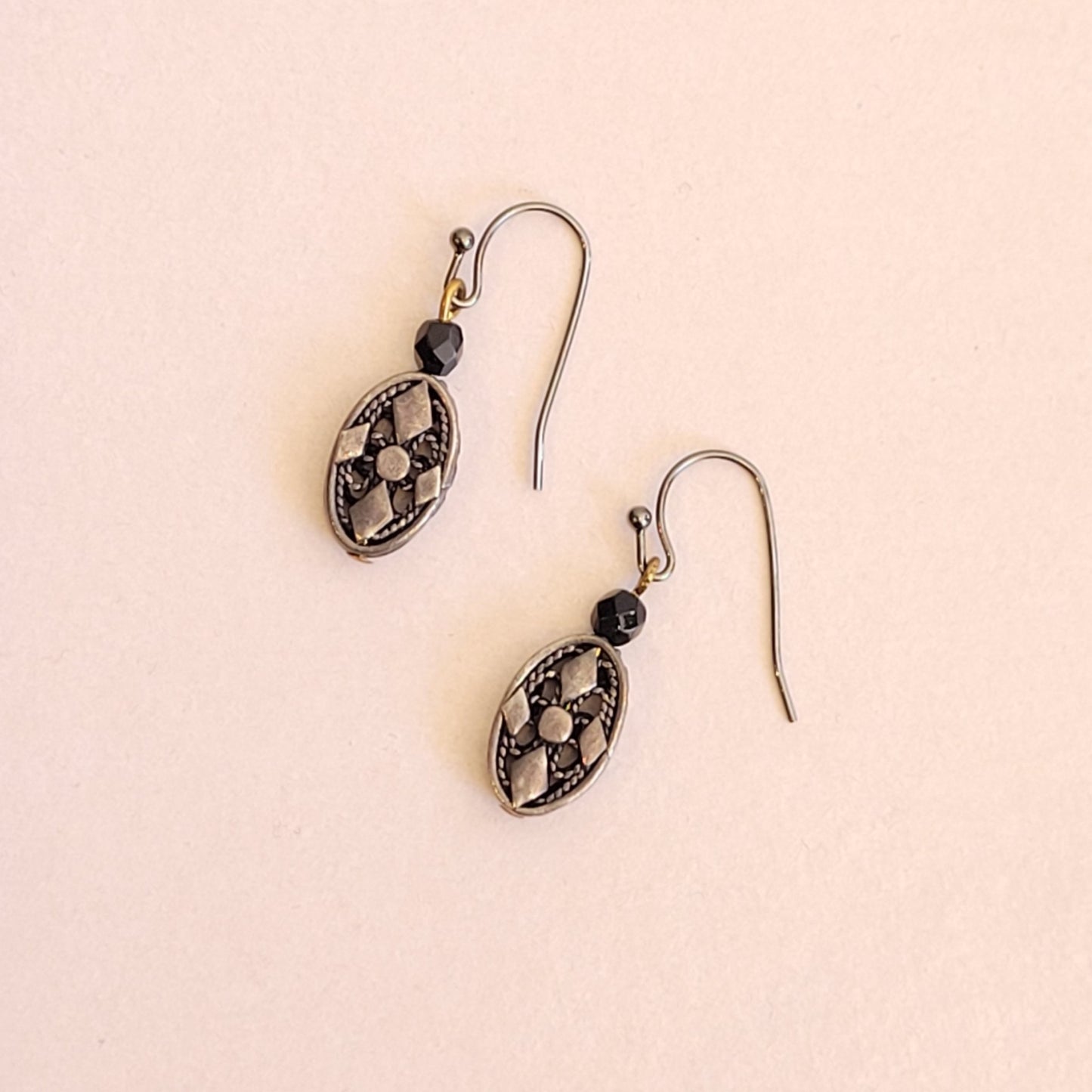 Elga; pewter oval openwork dangle